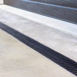 domestic drive way driveway channel drainage strip trench in front of garage drain black