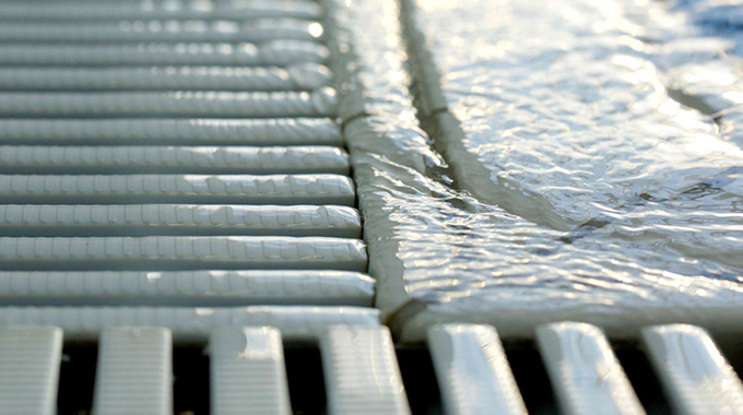 Close-up image showing polypropylene pool grates with interlocking clip system