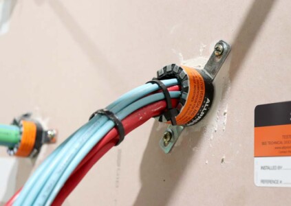 fire collar low profile plasterboard wall with data cables install