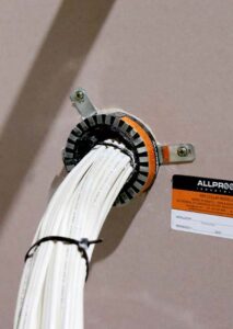 3 Core TPS cable bundle low profile faire collar on plasterboard wall with TPS power cables