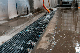 Allproof Commercial Channel draining overflow surface water at the wash facility that processes the recycled plastic used to make the channel.